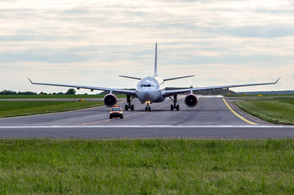 A plane on a runway, about to take off or recently landed.